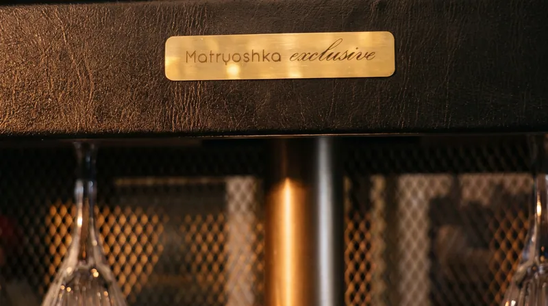The brass nameplate at dusk